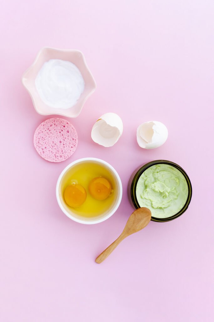 top-view-body-butter-eggs-pink-background